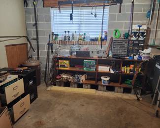 Loads of USEFUL items in the basement. Tools, cords, new items in box, electric lawn equipment, w&d, fridge, much more