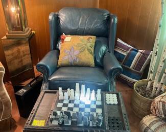 Great wingback chair and lovely hand carved game table with chess (missing 1 piece - sadly) and checker set 