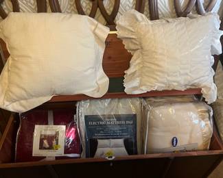 Cedar chest, blankets and pillows