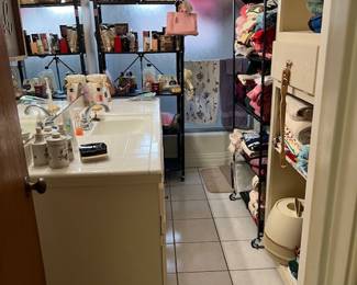 Various bathroom items.  Many towels still new with tags.