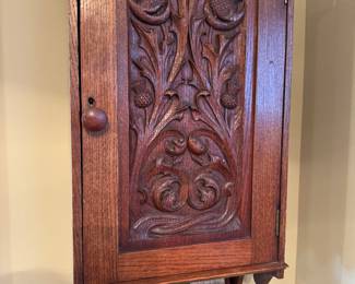 Carved hanging cabinet