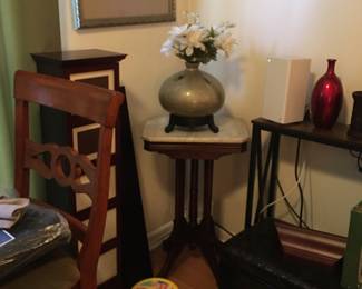 Marble table
Sit and spin child’s toy 
Storage trunk
Photo cabinet with photo books