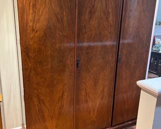 Large antique wardrobe. The left two units are attached to each other but come off the base. The right side can be moved by itself. 78”H x 60”W x 21”D