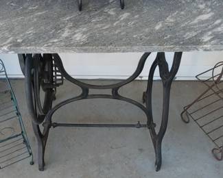 Cast iron sewing machine base with marble top