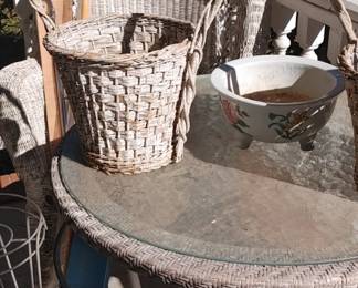 Beautiful beveled Edge glass outdoor table lots of older wicker furniture