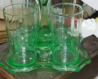 Excuse the mess ...but what a wonderful find. beautiful green uranium glass tumblers & holders