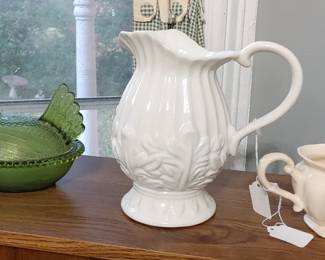Green hen on a nest dish and white Italian pitcher