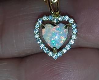 Opal heart pendant surrounded by Moissanite gold over sterling silver