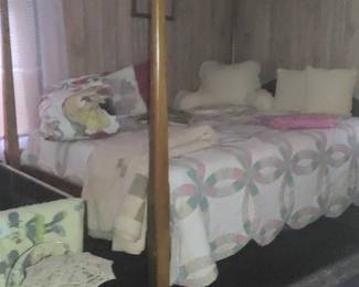 First bedroom on the left at the top of the stairs beautiful antique four poster bed antique quilts little girls toys and more