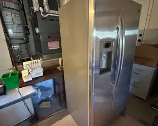 Two GE Profile counter depth stainless refrigerators. 