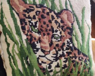 Numerous needlepoint pillows