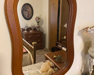 Close up of mirror to dresser