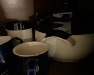 Complete set of “Denby” in second China cabinet in kitchen