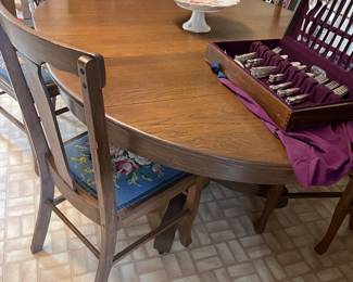 Table & matching chairs in kitchen - with leaf in table. Chairs all have hand stitched seats!