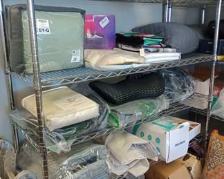 shelves full of goodies weighted blankets and more all new with tags