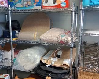 shelves full of goodies weighted blankets and more all new with tags