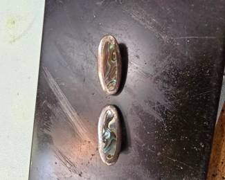 Sterling silver and abalone clip on earrings.