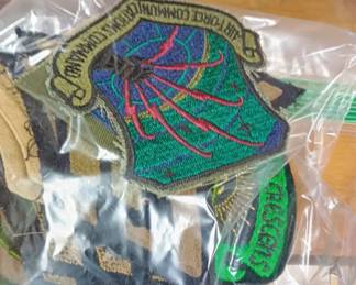 Bags of vintage military patches