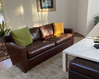 One of two:brown leather Coach couches in excellent condition