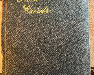 Vintage postcard album. See following photos for a sampling of the postcards included.