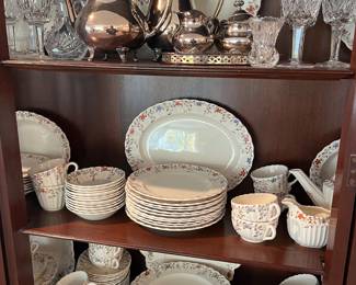 Large Spode “Wicker Dale” china set; mixed silverplate tea set (makers include Heirloom, Reed & Barton, and Sheffield Silver Co.); Waterford Crystal.