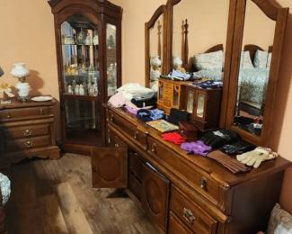 Dresser that matches bed.  Another curio cabinet in corner of room.