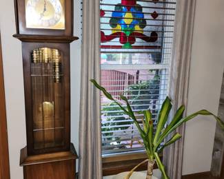 Grandfather clock, one of two stained glass panels