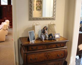 Pair of bombe chests & "Uttermost" silver gilt mirrors