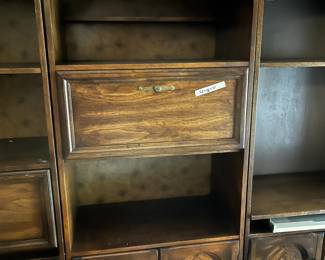 #59	Laminate book shelf with one drop down and 2 doors and one shelf (one missing pull)32x18x77	 $40.00 
