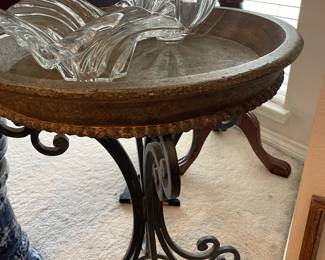 Heavy side table wrought iron and stone top. Mikasa crystal bowls with boxes 