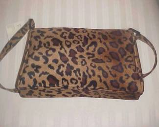 Designer purse (hundreds of them and most never used).