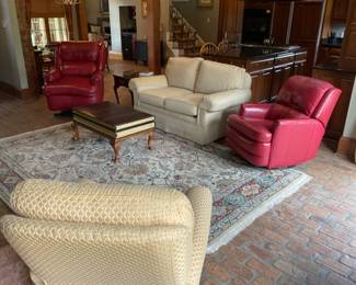 Hooker Book Motif Queen Anne Coffee Table, Hooker and Moore Swivel Rocker Recliner Coral Leather; Hooker and Moore Power Lift Chair Coral Leather; Sherril 64” Sofa Covered in Herringbone Oatmeal Fabric