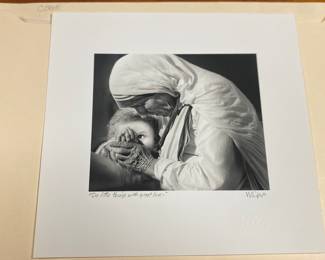 Photograph of Mother Theresa and child. “Do little things with great love”