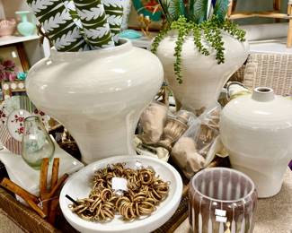 concrete garden table full of wonderful things. Wallpaper, pottery, hardware, marble.