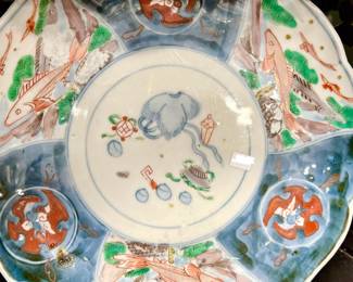 Notice the fish on the antique Imari plate.