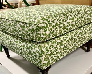 Fun green and white leaf upholstered ottoman.