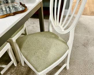 6 white dining chairs.