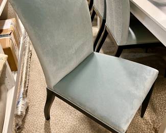 10 periwinkle blue dining chairs with fun white and blue backs.