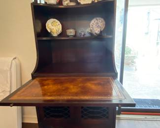 Beautiful small buffet with shelves, cupboard doors, drawer and a writing/serving pullout tray (Pictured out here)