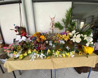 many artificial flower arrangements