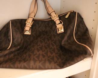 Chocolate medium leather Travel Tote bag
Michael Kors Collection