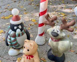 Lot 003-BH: Assorted Vintage Christmas Blow Molds #2

Includes: 
•	Vintage Toy Bear Blow Mold
•	Vintage Reindeer Blow Mold
•	Vintage Candy Cane Blow Mold
•	Vintage Penguin Blow Mold


Condition: Coloring is worn from age and use. These date from the late-1970s/early-1980s and were well-used for at least two decades.

•	The Toy Bear has a crack on its nose. It does light up.
•	The Reindeer does show some scratches. It lights up but the electric cord has a short in it.
•	The Candy Cane shows scratches. It does not light up at time of testing.
•	The Penguin also shows wear with scratches. It does light up.
