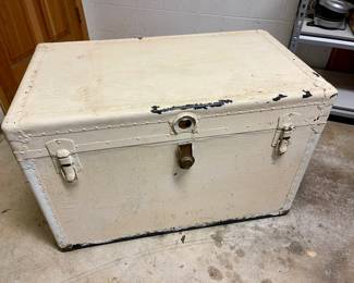 Lot 014-GAR: Vintage Travel Trunk

Features: 
•	Painted white metal exterior
•	Removable two-compartment top section
•	Spacious and rugged vintage piece!

Dimensions: 36”W x 21”D x 24”H


Condition: Good vintage pre-owned condition. One leather strap is broken/missing. We popped the lock on the clasp in order to open it; we don’t have the key.

