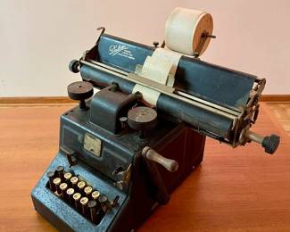 Lot 036-MC: Antique Dalton Adding Machine

Features: 
A remarkable piece of early office technology, this Dalton Adding, Listing and Calculating Machine showcases vintage industrial design with its sturdy metal construction and classic black finish. The machine features a row of numbered keys and boasts a wooden-handled hand-crank, capturing the essence of pre-digital calculation. An excellent collectible for history enthusiasts or lovers of unique mechanical devices.

Dimensions: N/A


Condition: Fair Antique condition; keys do press down/move; we didn’t thoroughly test the machine. It clearly needs to be cleaned and mechanically overhauled and adjusted in order to return to its original working condition.
