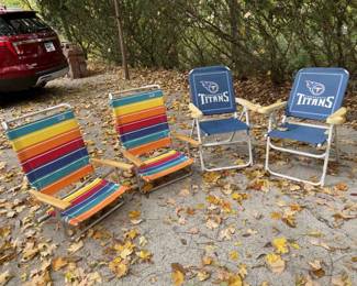 Lot 020-BH: Beach/Camping/Tailgating Chair Quartet

Includes: 
•	A pair of colorful RIO Beach chairs
o	Adjustable to 5-Positions 
o	Aluminum-frame
o	Wooden armrests

•	A pair of Tennessee Titans-themed chairs
o	Non-adjustable
o	Aluminum frame (painted)
o	Poly armrests; cup-holders in each armrest

Dimensions:
•	RIO chairs: 7” in height
•	Titans chairs: c. 16” in height

Condition: 
•	Rio chairs: Very Good pre-owned condition
•	Titans chairs: Good pre-owned condition; some discoloration/staining visible on seats; armrest color has faded from exposure to sunlight; frame paint has some nicks and scratches

