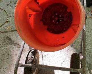 Lot 063-GAR: Kushlan Products Corded Concrete Mixer
Features: 
•	“The Enforcer”
•	350W, ½ HP, 115V motor
•	40RPM drum rotation speed
•	Polyethylene drum
Dimensions: See photo of Mixer Specs downloaded from manufacturer’s website.
Condition: Fair cosmetic condition; Good operating condition. Rugged and well-used machine!
