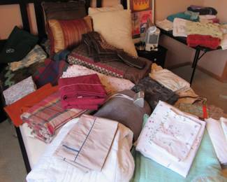 Lots of sheets, blankets, towels and more, including electric blankets.