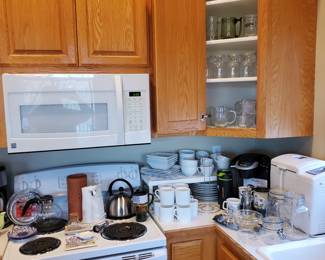Full size Keurig, bread maker, dishes and glassware.