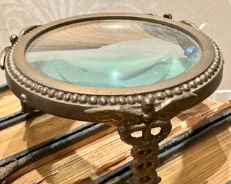 $80, antique magnifier with medical caduceus. 
