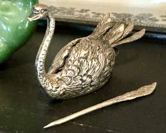 $100.  Unmarked silver swan cocktail picks.